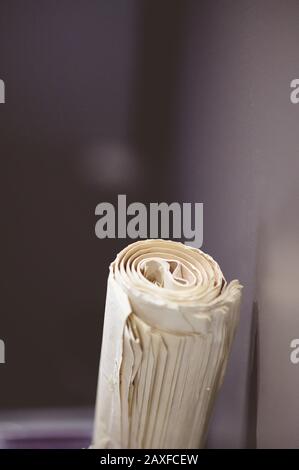 Watch hanging on the wall displaying five o'clock Stock Photo