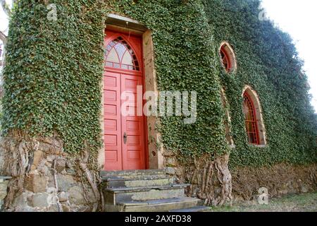 Entrance to the Rehoboth Rock Church/ Rehoboth Mennonite Church in Schuyler, VA, USA. Exterior walls covered in English Ivy. Stock Photo