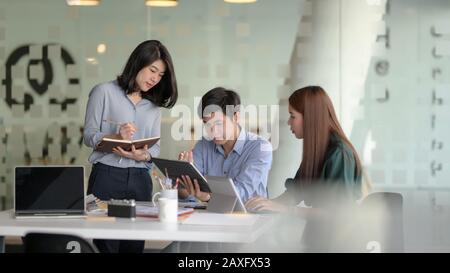 Group of professional UI application developer working on their project together Stock Photo