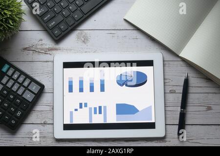 top view of financial chart display on digital tablet on office table  Stock Photo
