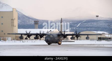 An Alaska Air National Guard HC-130J Combat King II, operated by members of the 211th Rescue Squadron, taxis on the flight line after landing at Joint Base Elmendorf-Richardson, Alaska, Feb. 7, 2020. Alaska Air National Guardsmen from the 211th Rescue Squadron and supporting Airmen from other 176th Wing units returned to JBER after deploying to Al Asad Air Base, Iraq in support of Operation Inherent Resolve. (U.S. Air Force photo by Alejandro Peña) Stock Photo