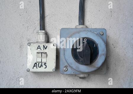 old light switches in an abandoned former factory in Magdeburg in Germany Stock Photo