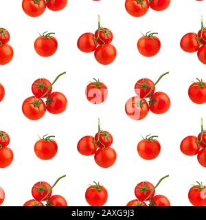 Seamless pattern of red tomatoes on white background isolated closeup, whole cherry tomato bunch repeating ornament, fresh vegetables art wallpaper Stock Photo