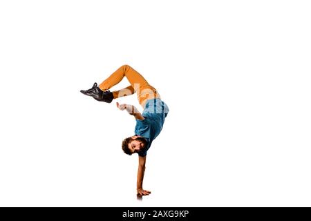 Amazing dancer is doing breakdance on a white background Stock Photo
