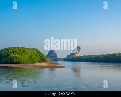 Khao Khanab Nam mountains, famous mountain on river on blue sky background, landmark of the Krabi city, Krabi province, Thailand. Stock Photo
