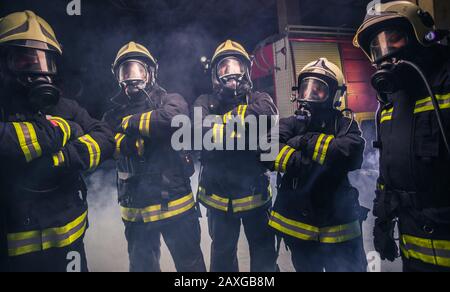 J*y様 90-'s euro vintgage Fireman Work Ja Firefighter With Fire Hose Over Shoulder High-Res Stock