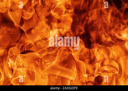 Blaze red fire natural background. Dangerous firestorm abstract texture. Atmospheric dispersion, defocus (soft focus), motion blur from fire Stock Photo