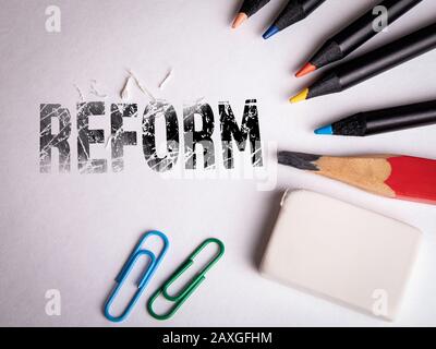 Reform. Taxation, Health, Education and Public Administration concept. Pencil and eraser on white background Stock Photo