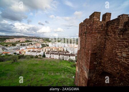 Looking down at rooftops and cityscape of Silves Portgual from the castle ruins - Algarve Region Stock Photo