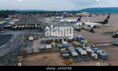 Harrisburg , Pennsylvania / United States - 08 16 2019: Transport containers are loaded onto trucks from cargo airplanes at Harrisburg International Stock Photo