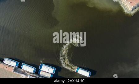 Aerial view of  Melaka River cruise as boat's wake make an.  interesting pattern on the river in Malacca, Malaysia Stock Photo