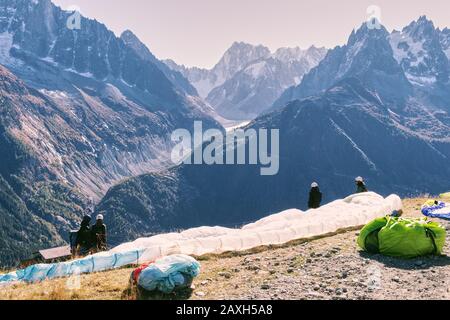 Paragliding in the high mountains of Haute Savoie, France. Paragliders get ready to take off. Stock Photo