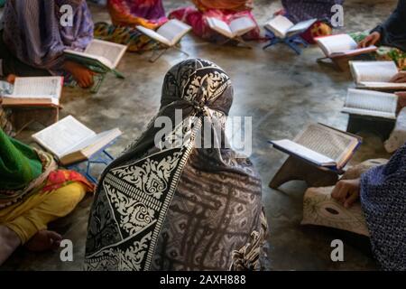 Orphan Girls are studying Quran in a religious institution, At laxmipur  Bangladesh. Stock Photo