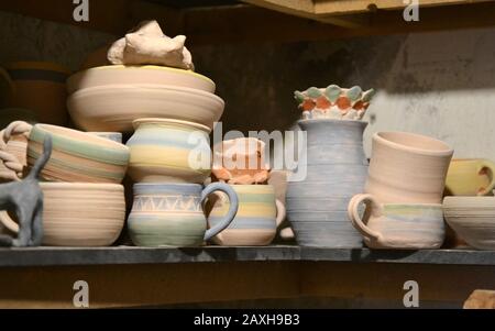 Ceramic clay products stand on the shelf close-up, macro Stock Photo