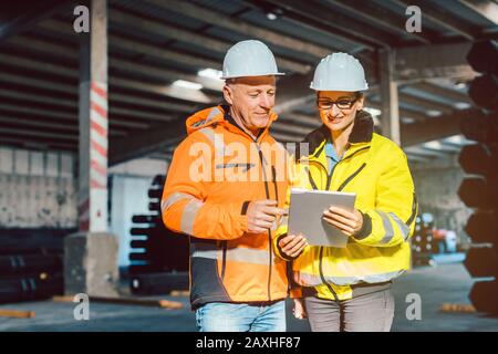 Workers checking inventory of warehouse Stock Photo
