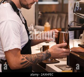 Unrecognizable Barista Making Coffee Working In Cafe Indoor, Cropped Stock Photo