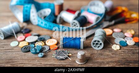 Group of objects about Sewing equipment set on a wooden background. Sewing and tailoring concept Stock Photo