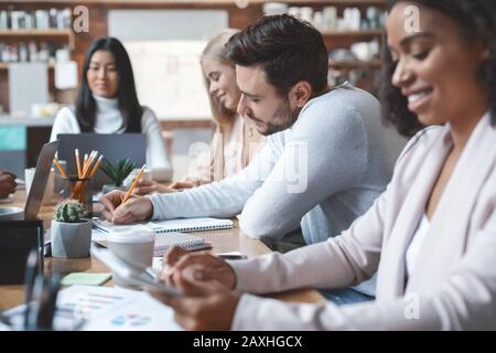 Working process of young multiracial business team Stock Photo