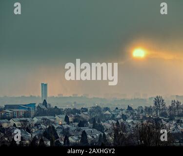 Glasgow, Scotland, UK, 12th February, 2020: UK Weather: Stormy weather and dawn saw snow showers over the west end of the city produce spooky lighting to the city silhouettes . Copywrite Gerard Ferry/ Alamy Live News Stock Photo