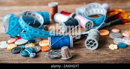 Group of objects about Sewing equipment set on a wooden background. Sewing and tailoring concept Stock Photo