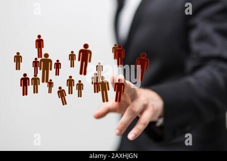 Businessman presenting the digital projection of people network Stock Photo