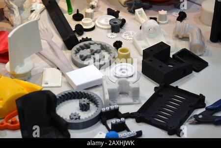 Objects printed by 3d printer. Bright colorful objects printed on a 3d printer on a table Stock Photo