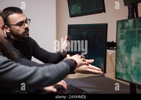International and dangerous hacker talking abot their new target for cyber attacks. Stock Photo