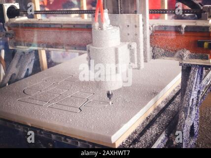 Milling machine cut out from white material pattern closeup Stock Photo