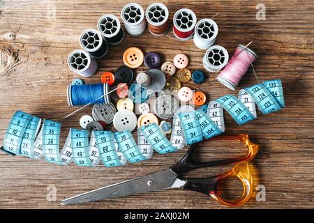 Group of objects about Sewing equipment set on a wooden background. Sewing and tailoring concept Stock Photo