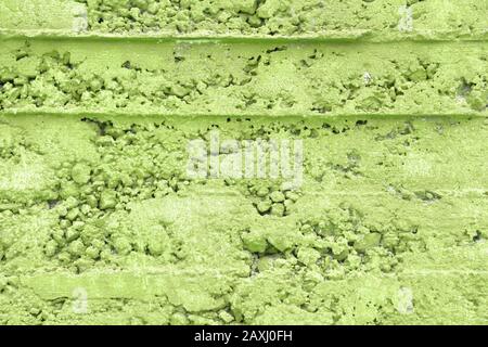 Green grunge wall texture. Rough grungy background. Conifer green shade. Stock Photo