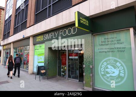 LONDON, UK - JULY 7, 2016: People walk by Marks & Spencer Simply Food grocery store in London. Simply Food is a special convenience store format by Ma Stock Photo