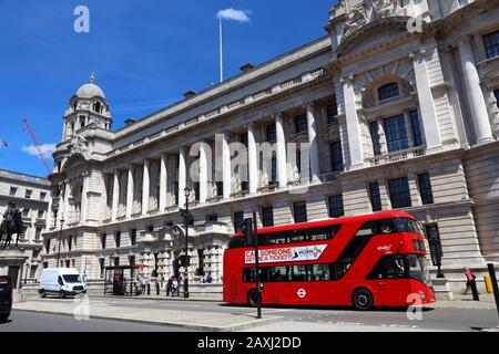 LONDON, UK - JULY 6, 2016: People ride New Routemaster bus in Whitehall, London. The hybrid diesel-electric bus is a new, modern version of iconic dou Stock Photo