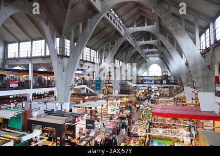 WROCLAW, POLAND - MAY 11, 2018: Shoppers visit Wroclaw Market Hall (Hala Targowa) in Poland. The indoor marketplace exists since 1908. Stock Photo