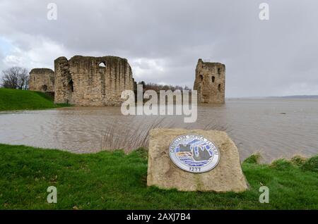 Flint, Wales, UK: Feb 11, 2020: An unusually high spring tide in the aftermath of storm Ciara sees water from the River Dee reaching to the walls of t Stock Photo