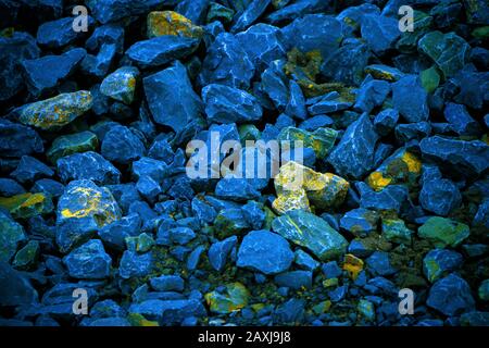 Several blue gravel stones on the ground Stock Photo