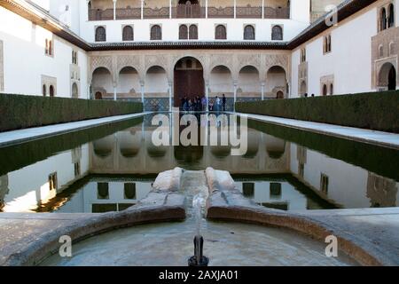 Granada Spain, sightseers in front of the southern facade in the Court of the Myrtles at the Alhambra Stock Photo