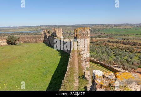 Defensive walls and the ramparts with view over surrounding countryside  Castle of Terena, a listed national monument, Alentejo Central, Portugal Stock Photo