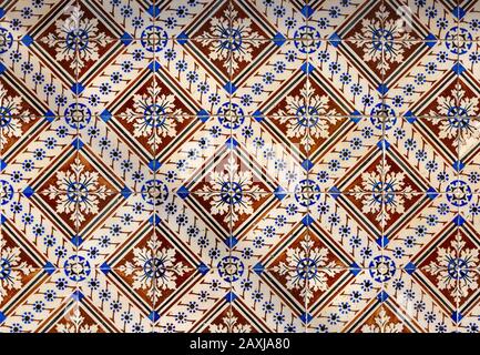 Historic old patterned ceramic tiles on a wall in Portugal Stock Photo