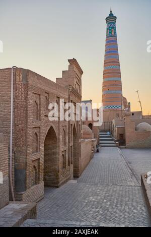 Islam Khodja or Islam Khoja Minaret and Madrassah, Itchan-Kala, Khiva, Uzbekistan, Central Asia Stock Photo