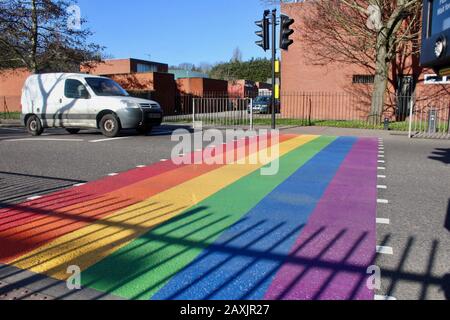 The rainbow painted LBGTQ supporting pedestrian crossing outside woodside high school haringey wood green london UK Stock Photo