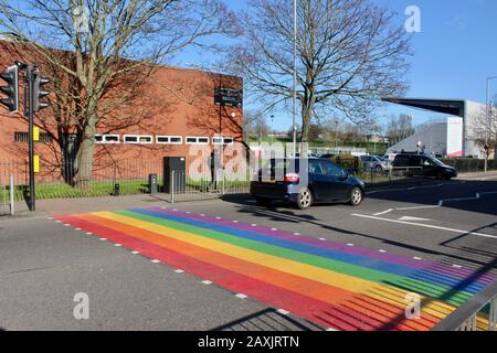 The rainbow painted LBGTQ supporting pedestrian crossing outside woodside high school haringey wood green london UK Stock Photo