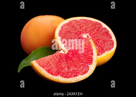 Grapefruit with leaf closeup isolated on black background Stock Photo
