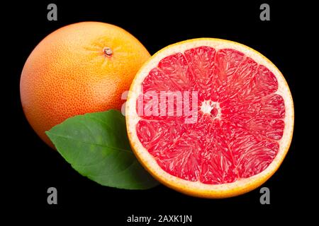 Grapefruit with leaf closeup isolated on black background Stock Photo