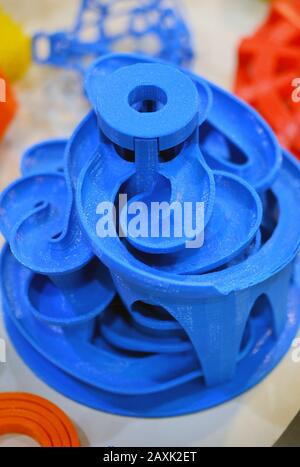 Objects printed by 3d printer. Bright colorful objects printed on a 3d printer on a table Stock Photo