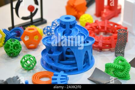 Models printed by 3d printer. Bright colorful objects printed on a 3d printer on a table Stock Photo