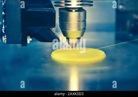 3D printer print objects on surface close-up. Modern 3D printing technology Stock Photo