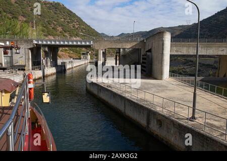 The hotel barge 'Spirit of Chartwell' entering a lock on the River Douro, Portugal. Stock Photo