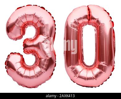 Number 30 thirty made of rose golden inflatable balloons isolated on white. Helium balloons, pink foil numbers. Party decoration, anniversary sign for Stock Photo