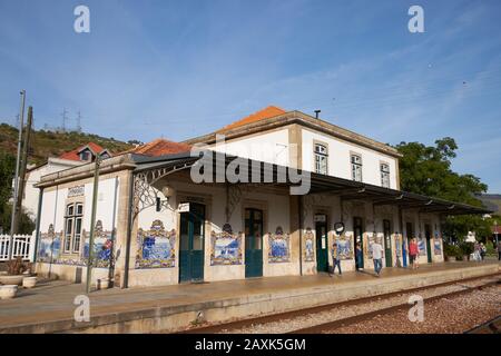 Pinhao railway station, Douro, Portugal. The building is decorated with blue ceramic tiled mosaics of local scenes in the Douro region. Stock Photo