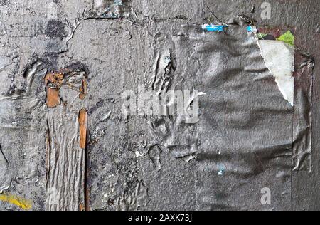 Texture of colorful old weathered paint peeling on walls Stock Photo